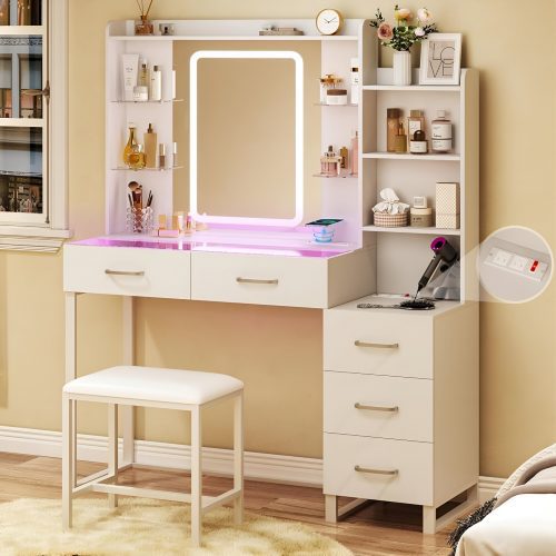 Modern white makeup vanities with LED mirror, drawers, shelves, and cushioned stool, featuring organized beauty products and a hairdryer, perfect for a 2025 glam setup from Amazon.