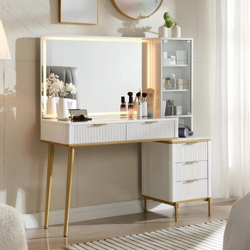 Sophisticated white makeup vanity with gold legs, LED mirror, and glass storage cabinet, showcasing a luxurious 2025 Amazon glam vanity setup with beauty products.